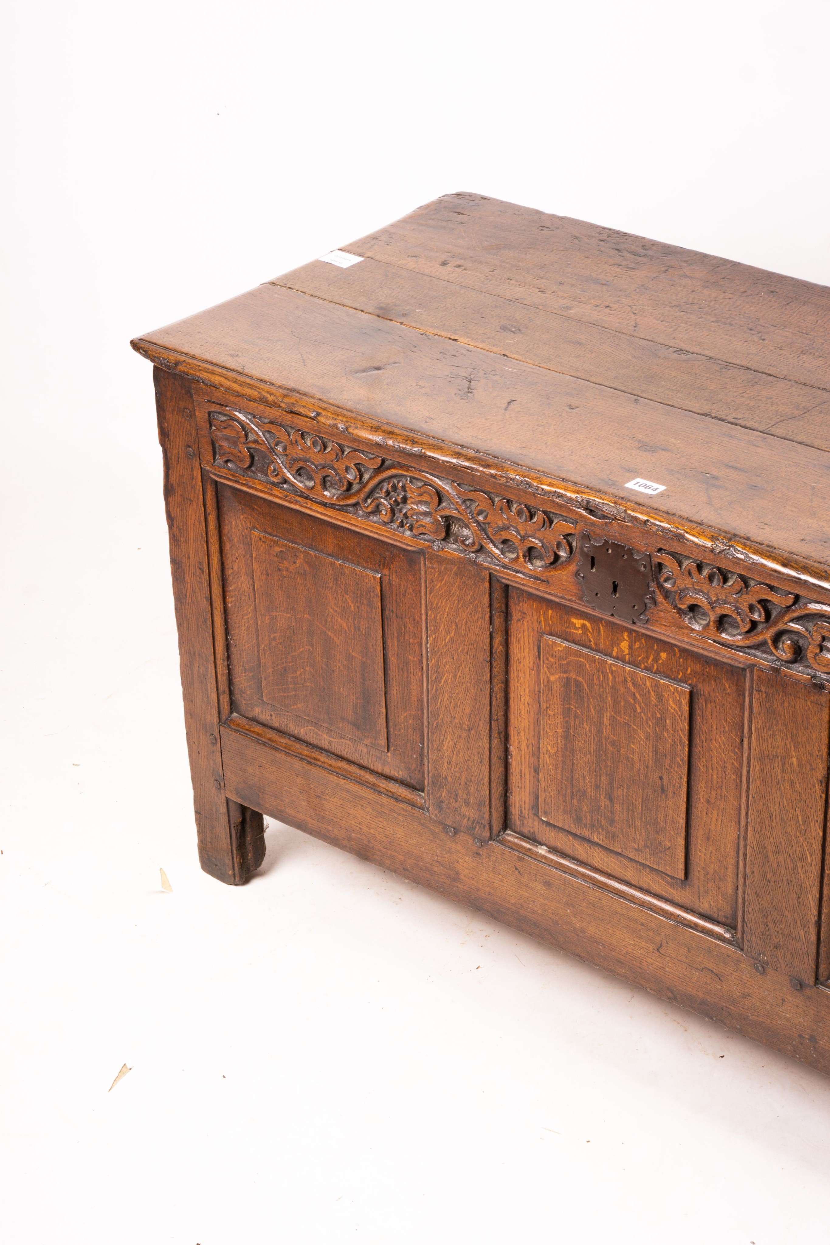 A 17th / 18th century carved oak coffer, length 132cm, depth 53cm, height 64cm